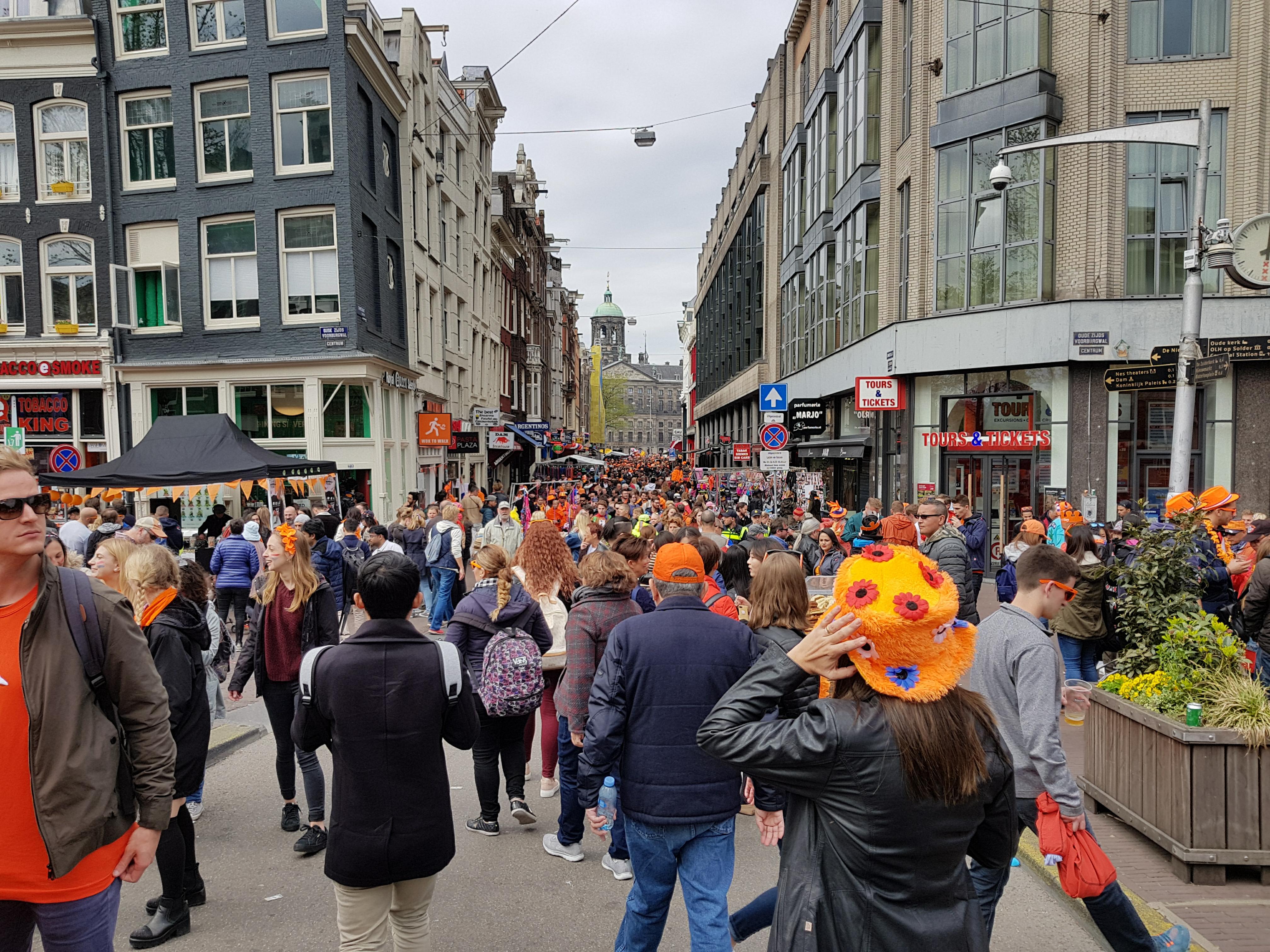 A crowded Street In Amsterdam on King's day