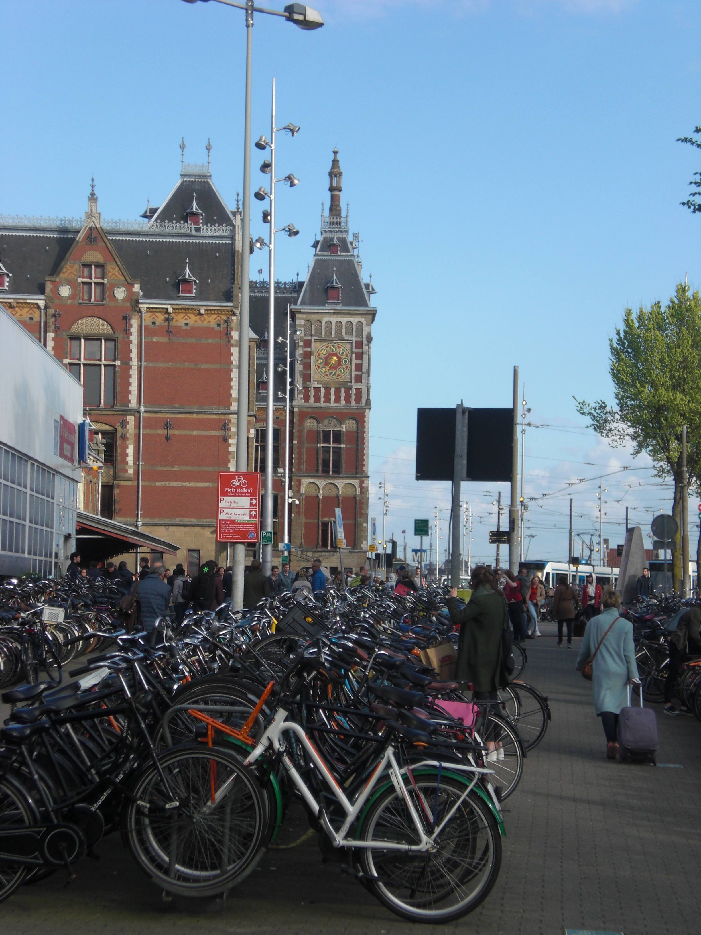 Amsterdam Central Station with lots of bikes in the foreground