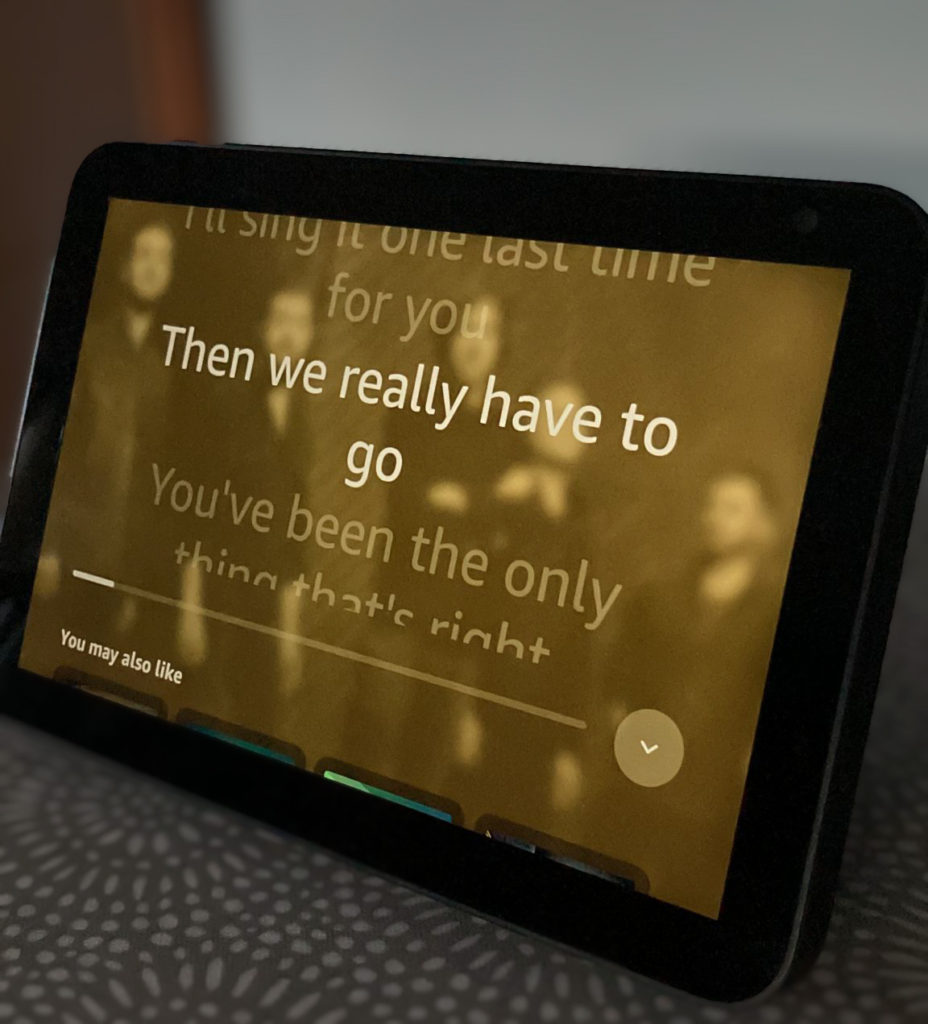 An Amazon echo show 8 screen with song lyrics on it