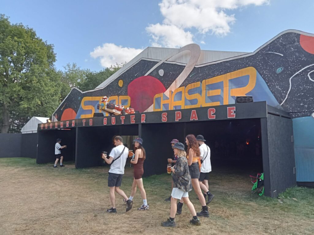The entrance to a music tent with "Star chaser" painted above the entrance