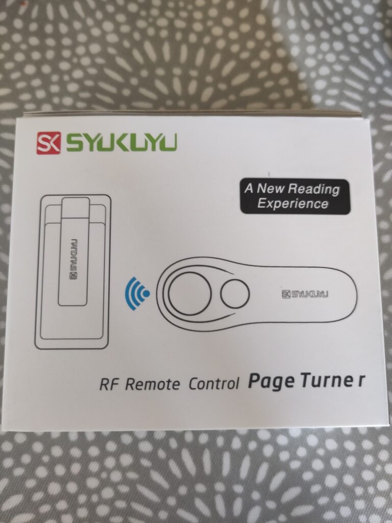 A box on a table which says "SYUKUYU RF remote control page turner"